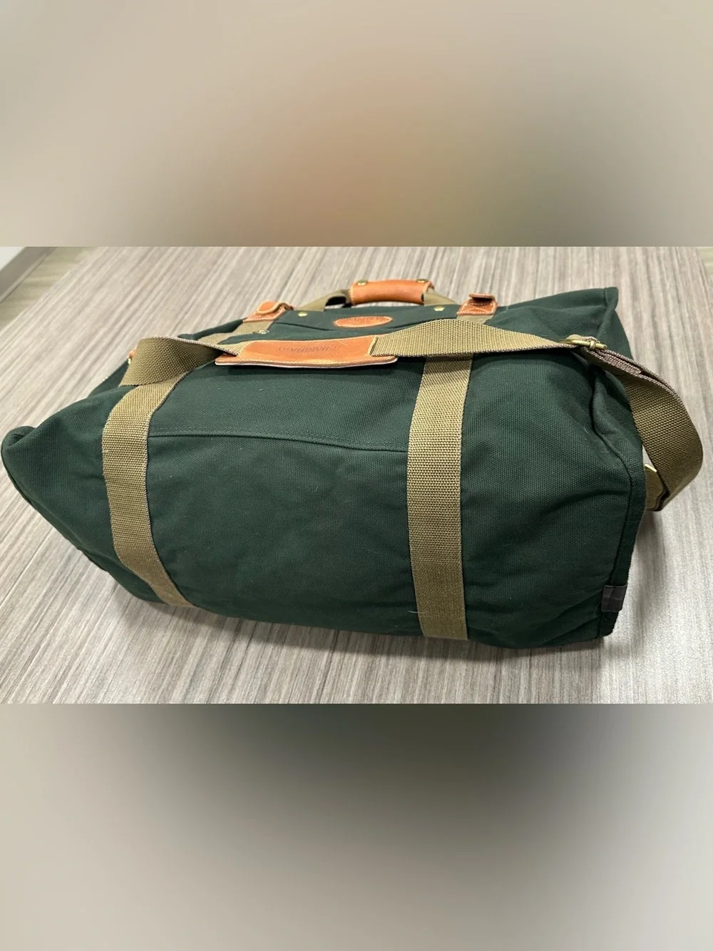 Tumi Dakota Dark Green Canvas Duffel with Tan Straps and Brown Leather Trim